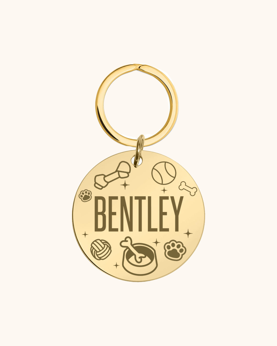 Gold pet tag with 'Bentley' engraved, featuring various dog-related icons on a white background.