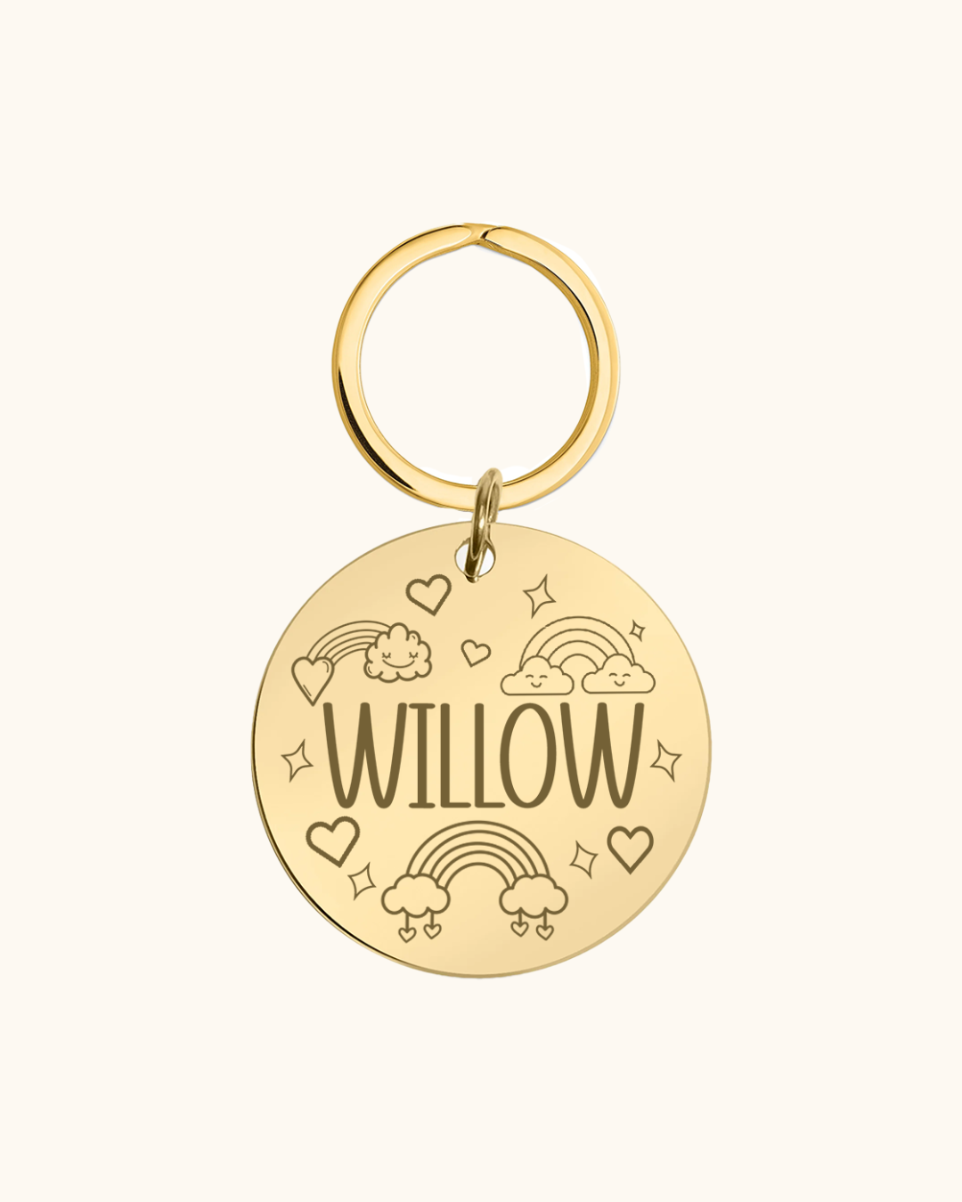 Gold pet tag with 'WILLOW' engraved on a white background