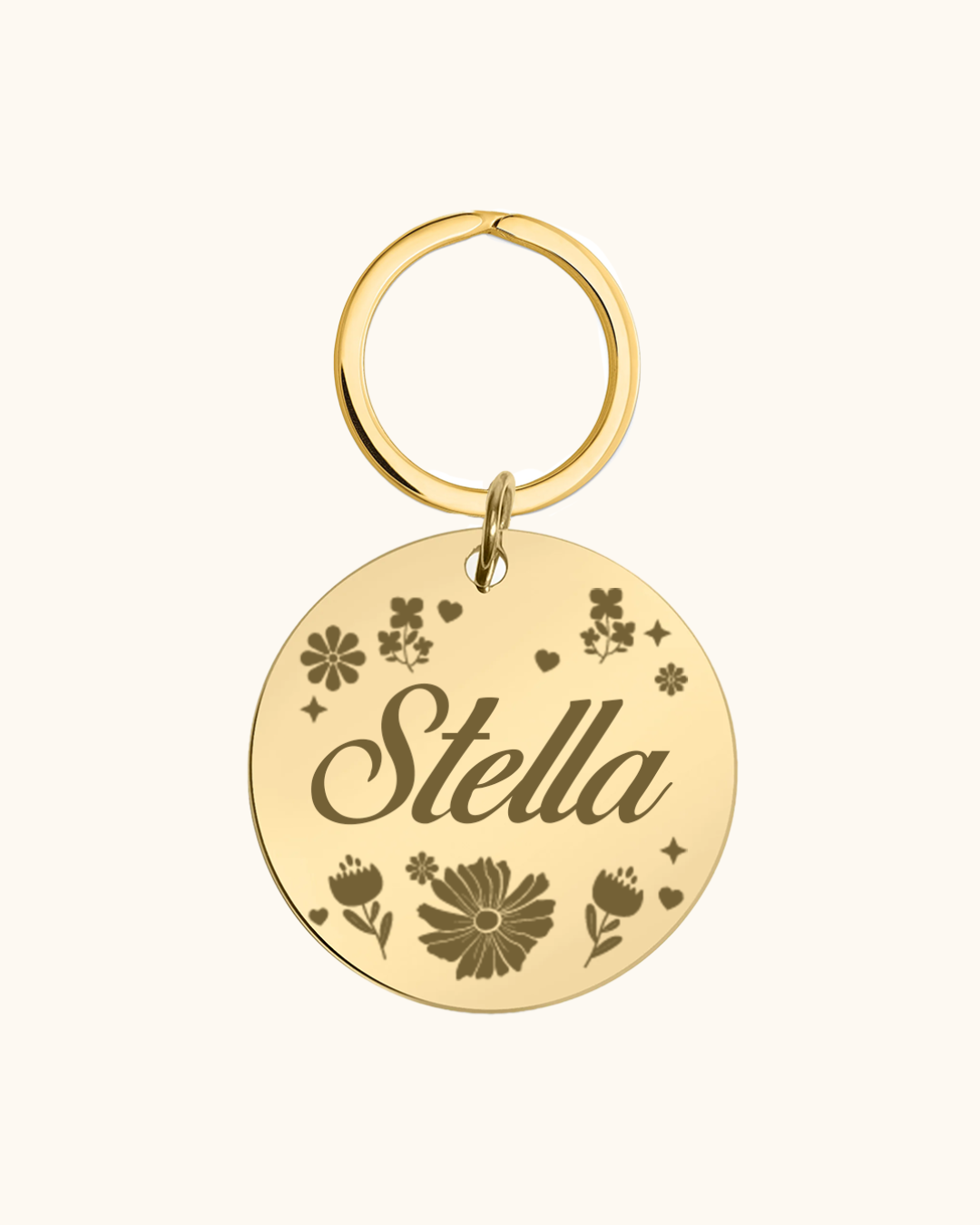 Gold pet tag with 'Stella' engraved on a white background