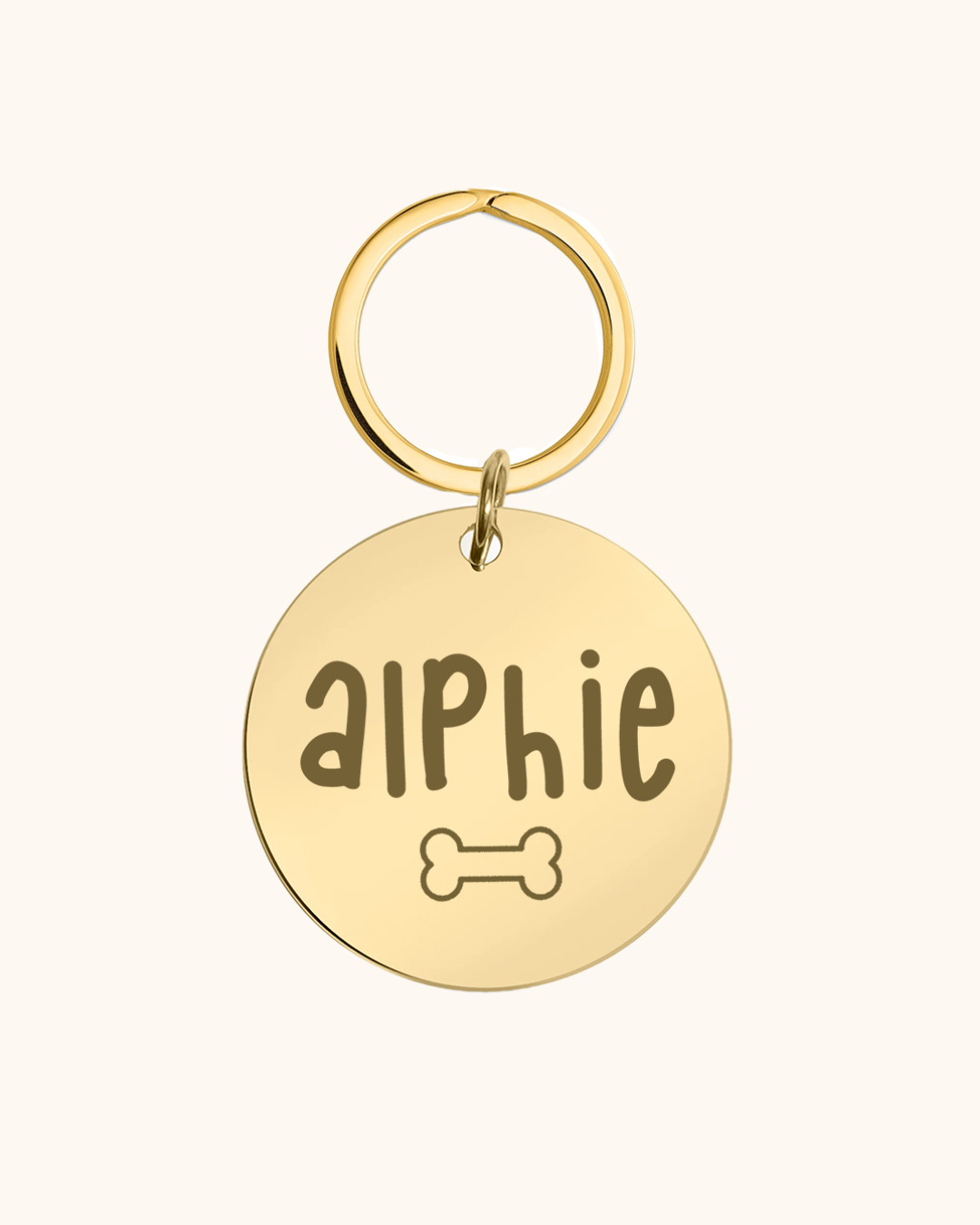 Gold pet tag with 'Aiphie' and a bone symbol on a white background
